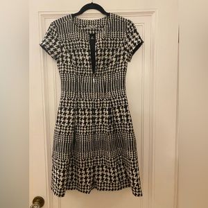 UEC Eliza j brand black and cream patterned zip up dress. Short sleeve. Size 2